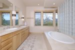Main-level master ensuite- Walk-in shower- Jetted tub- Dual vanity